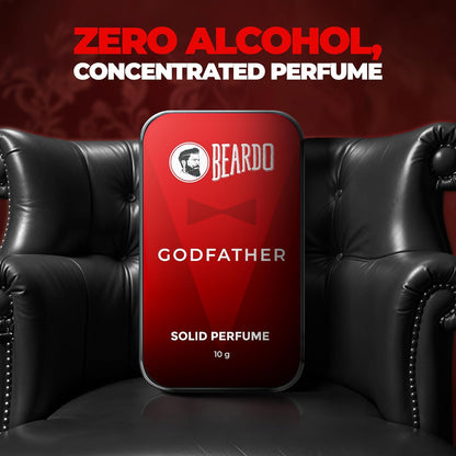 Beardo Godfather solid perfume tin on a black leather couch with red background