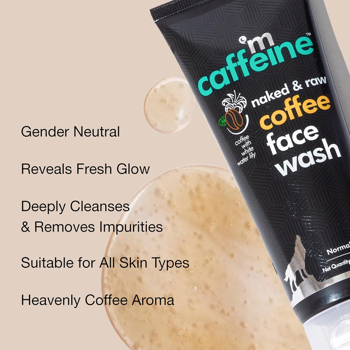 Tube of 'm caffeine naked & raw coffee face wash' with product details on a beige background