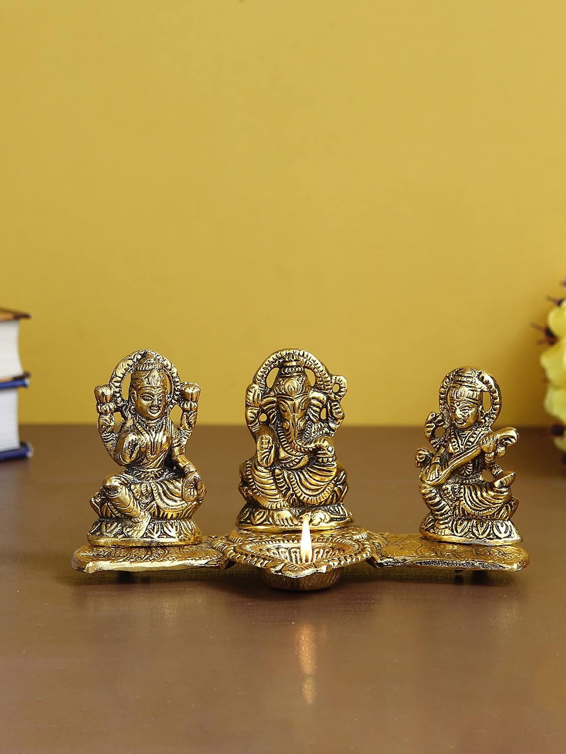Golden Metal Handcrafted Lakshmi Ganesha Saraswati Idols with Diya On Leaf Chowki - Auspicious Decorative Idols & Diyas for Puja Room, Home, Office, Temple - Gift for Diwali, Housewarming