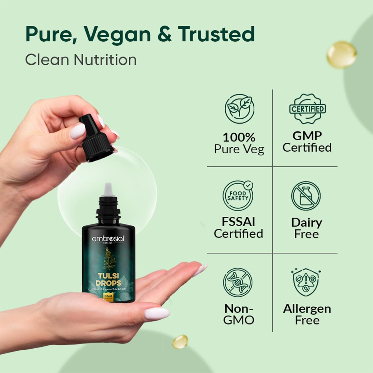 Bottle of Tulsi Drops held by a hand with certification icons on a green background