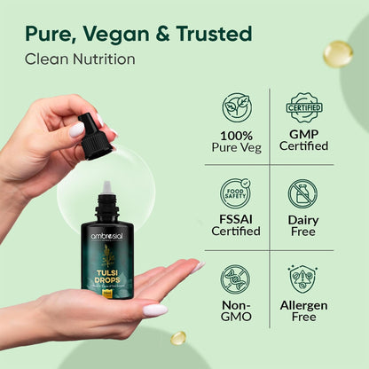 Bottle of Tulsi Drops held by a hand with certification icons on a green background