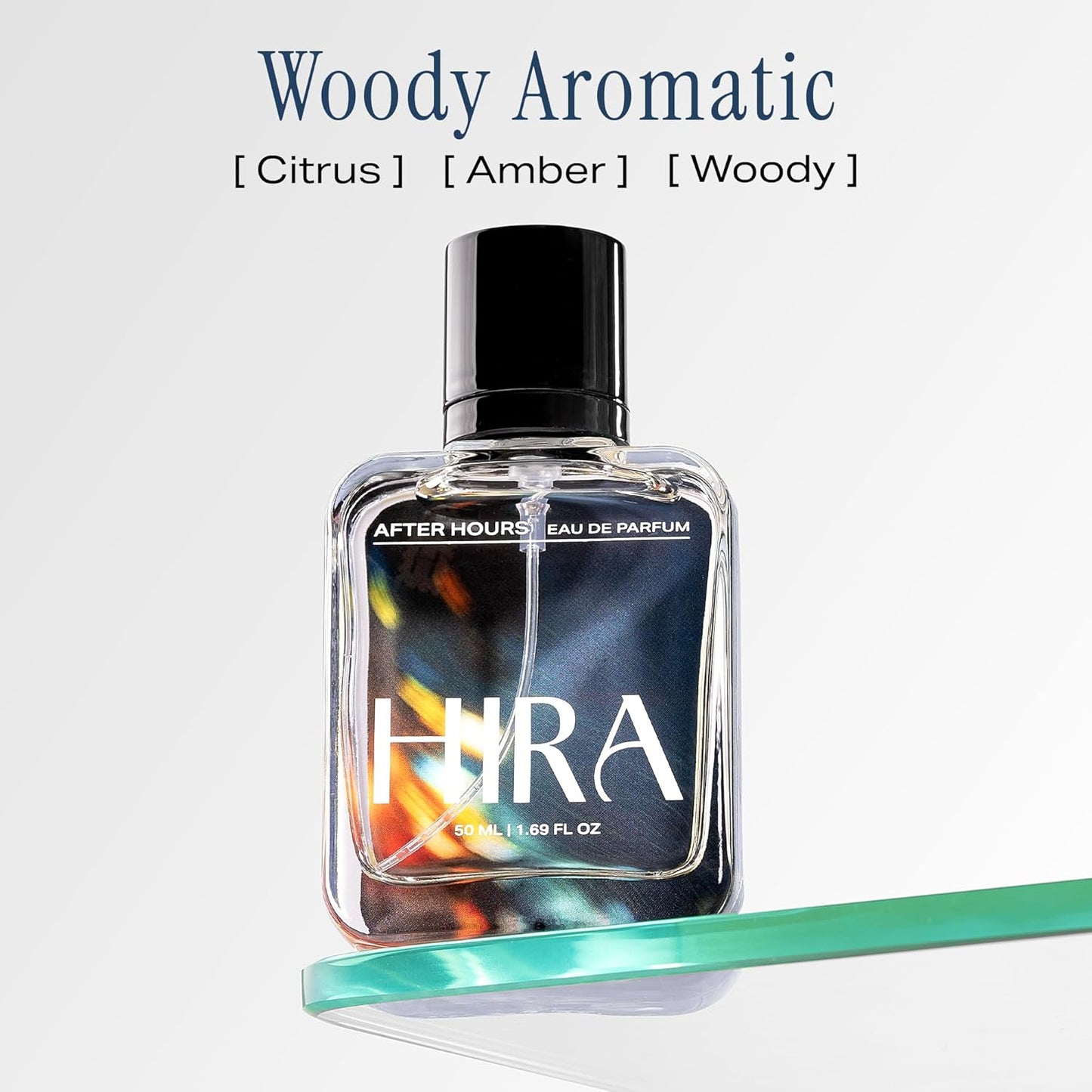 HIRA perfume bottle with 'Woody Aromatic' description on a light gray background