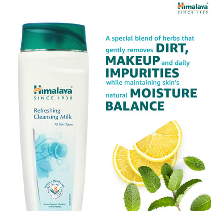 Himalaya Refreshing Cleansing Milk bottle with lemon slices and mint leaves on a white background