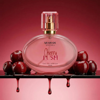 Pink perfume bottle labeled 'Cherry Lush' with cherries on a red background