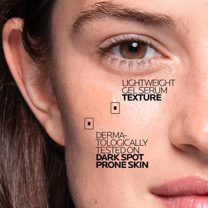 Close-up of a person's face with text about a skincare product on the skin.