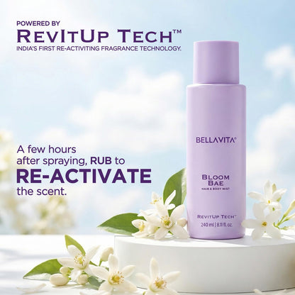 Bellavita Bloom Bae hair and body mist bottle with flowers on a light background