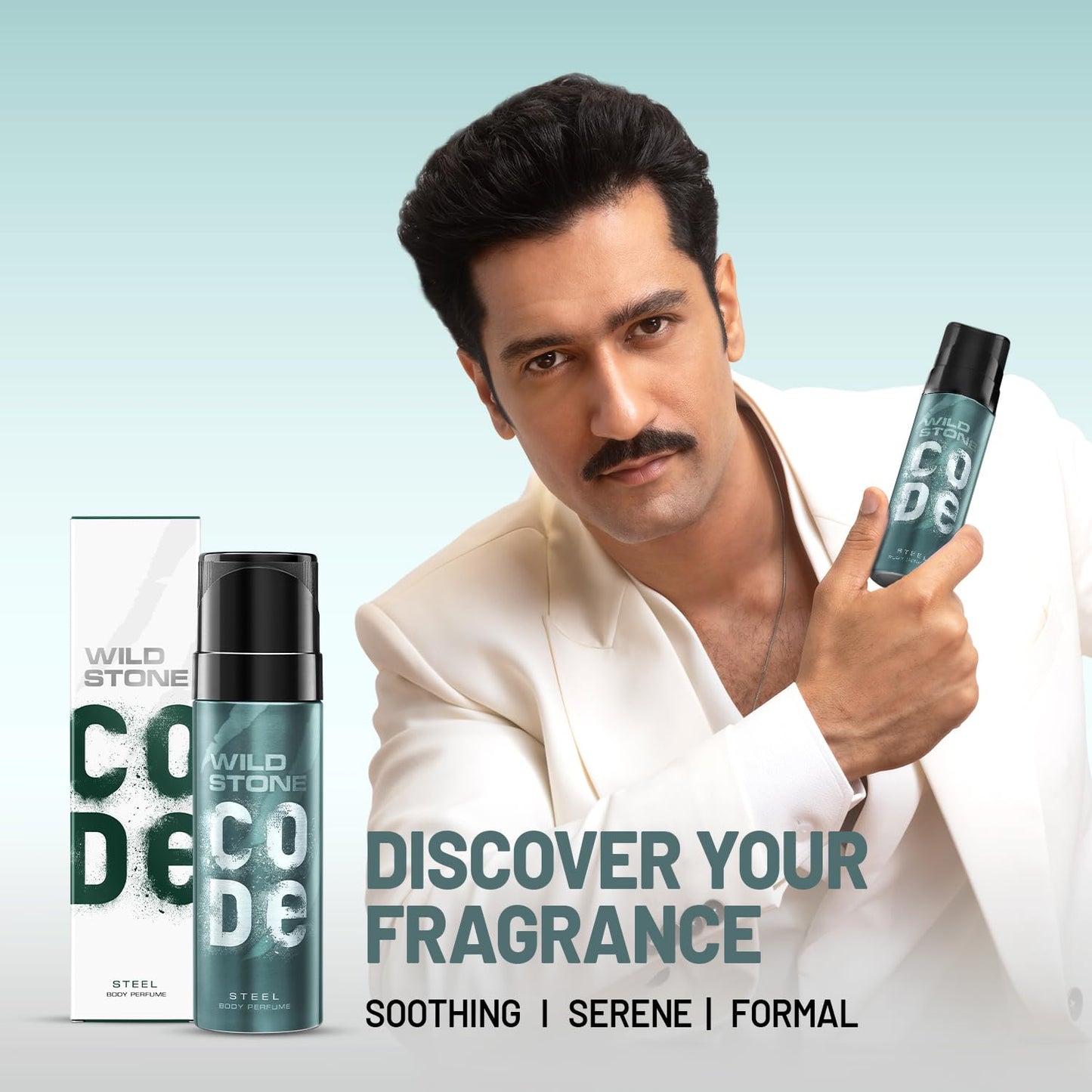Man holding Wild Stone Code deodorant with product packaging on a light blue background