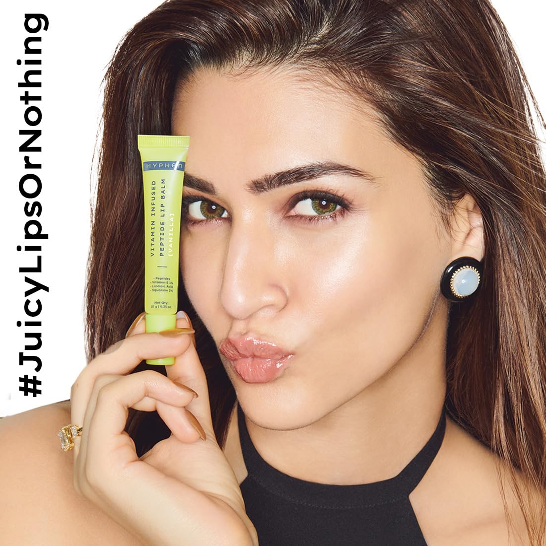 Woman holding a green lip balm with 'JuicyLipsOrNothing' text