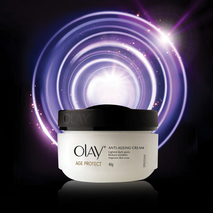 Olay anti-aging cream jar with a black lid on a dark background