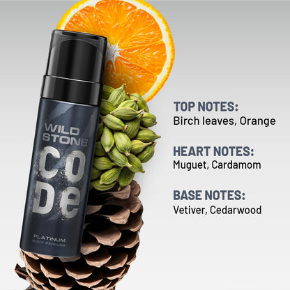 Wild Stone Code perfume bottle with an orange, pine cone, and cardamom on a gray background