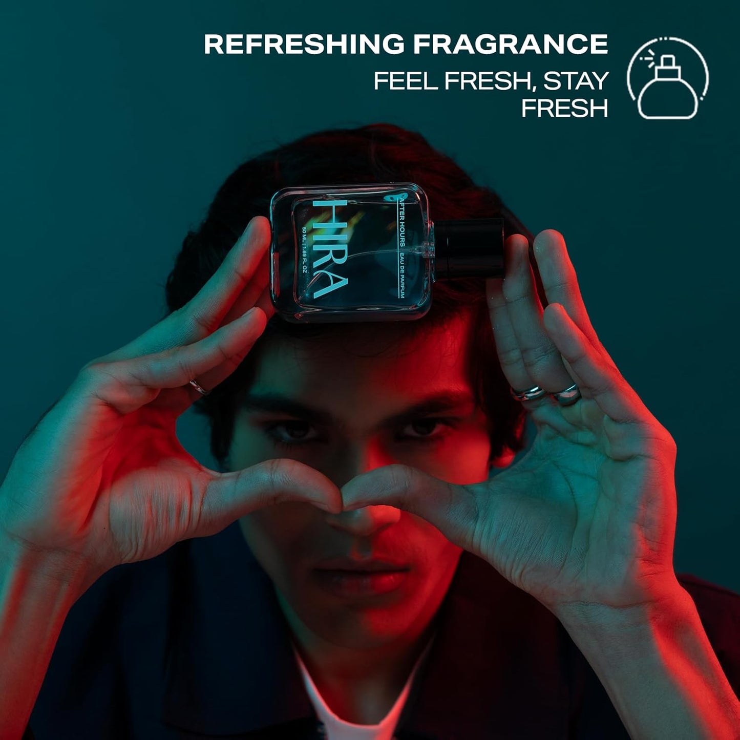 Person holding a perfume bottle with 'Hira' branding against a dark background, promoting refreshing fragrance.