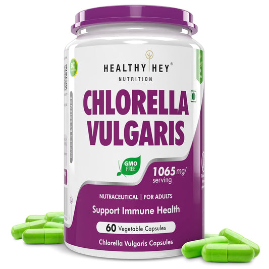 Container of Healthy Hey Nutrition Chlorella Vulgaris supplement with green capsules on a white background