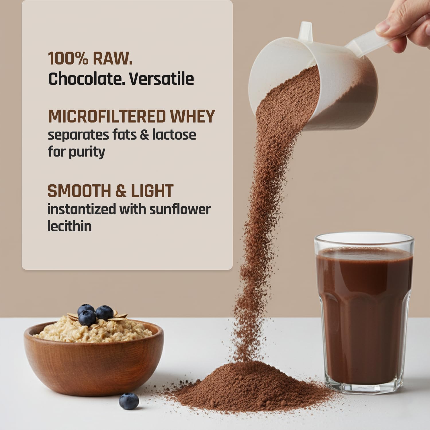 Chocolate powder being poured into a glass with a bowl of cereal and blueberries on a beige background.