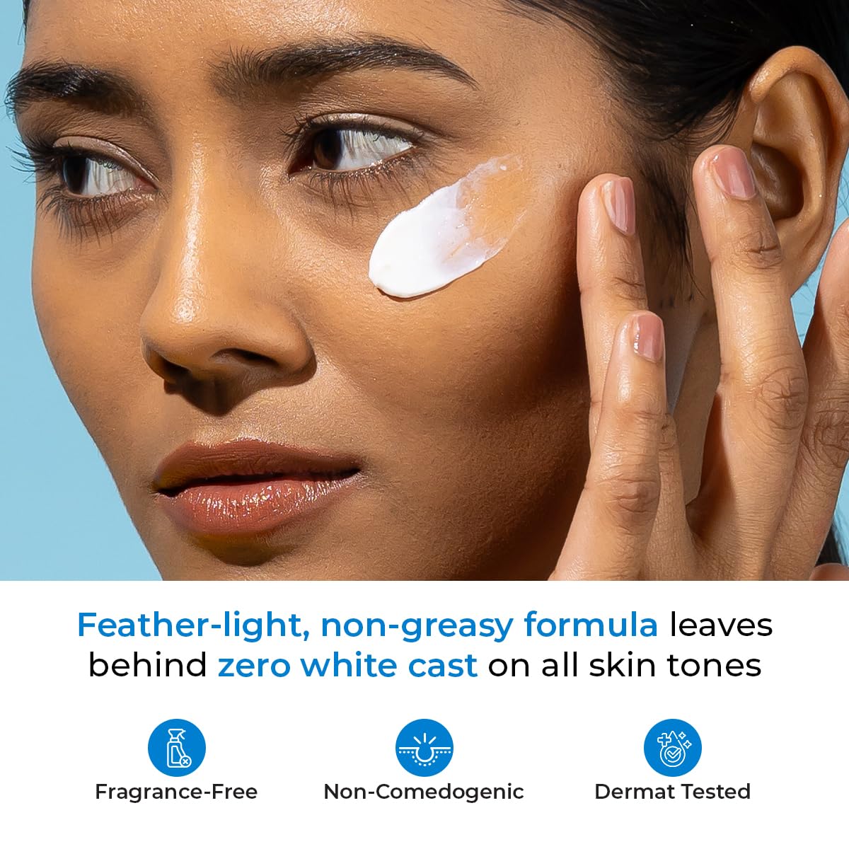 Woman applying cream to her face with a blue background and product features displayed.