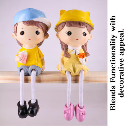 Kiss & Bouquet Gift Set Decorative Showpiece |Gift for him/her or Someone Special | Polyresin Couple Wearing Cute Caps Hanging Legs Showpiece - 2 Pcs Set