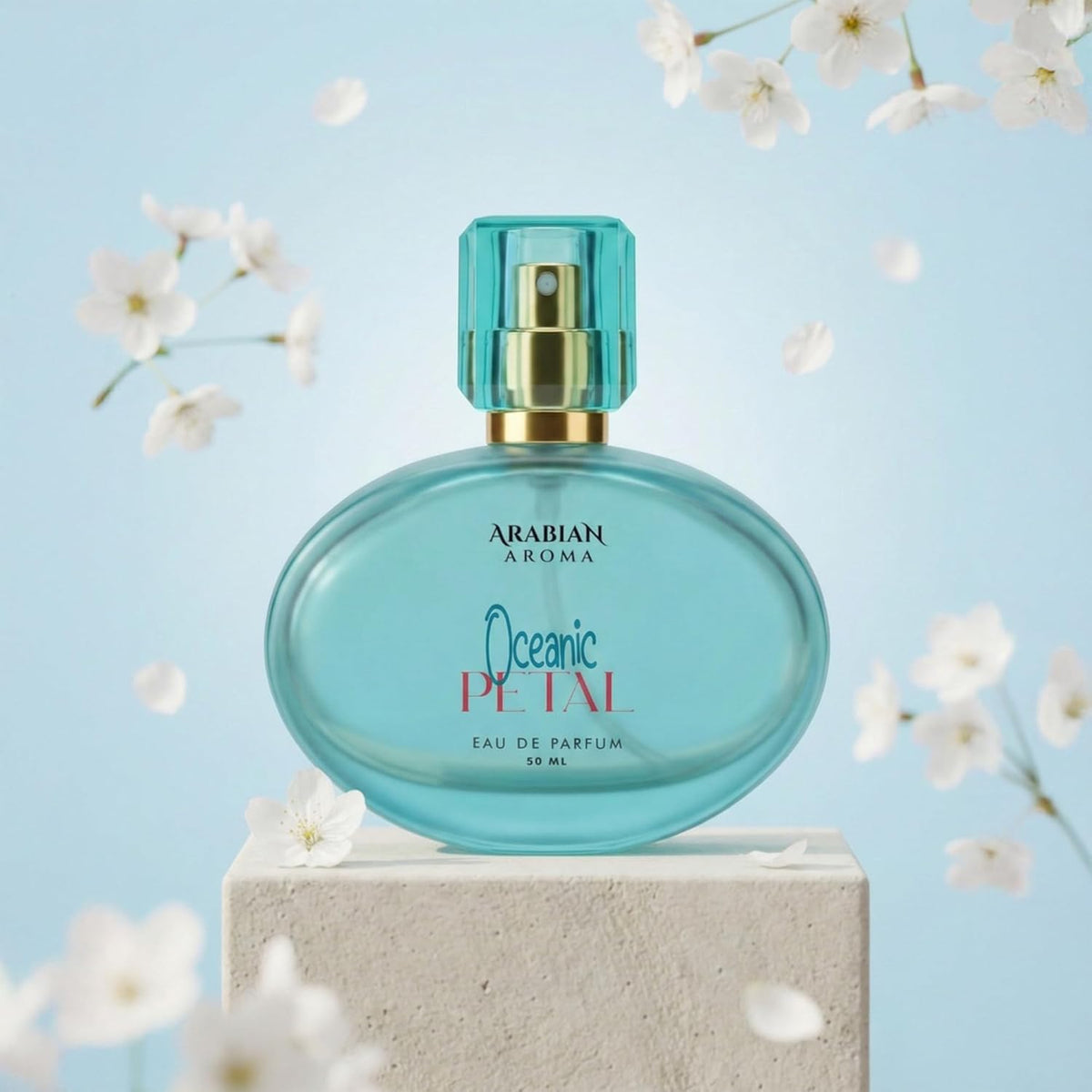Blue perfume bottle labeled 'Arabian Aroma Oceanic Petal' on a light blue background with white flowers.