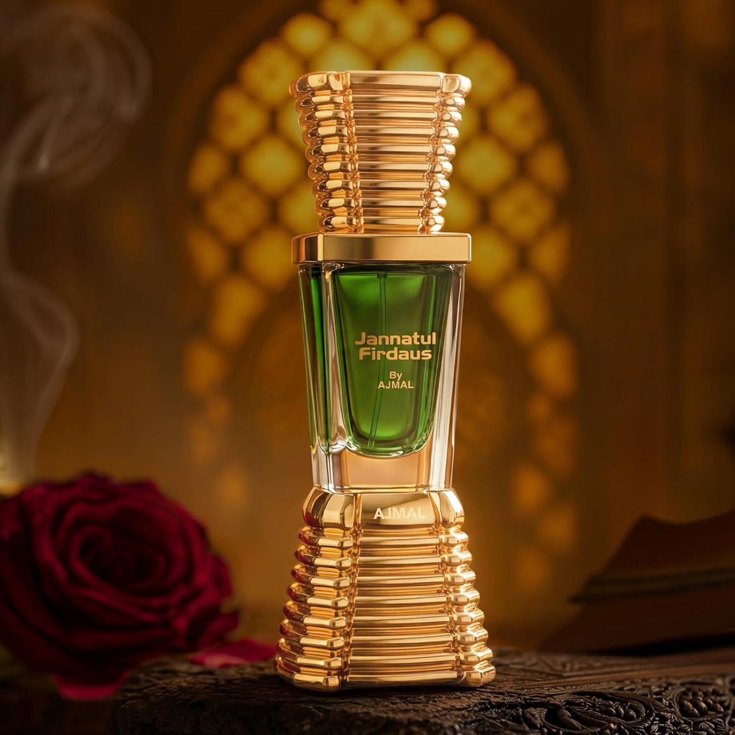 Perfume bottle labeled 'Jannatul Firdaus' by Ajmal with a blurred rose and decorative background