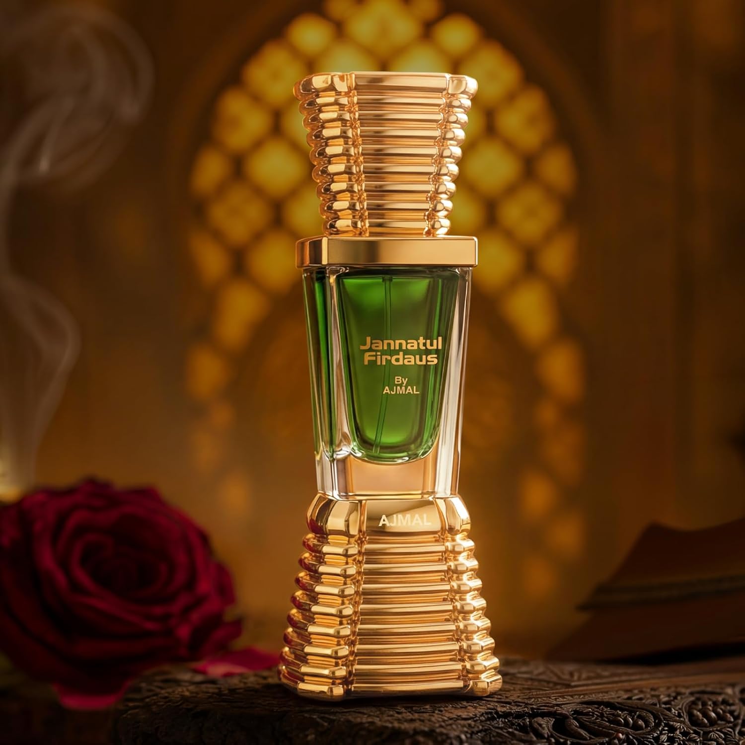 Perfume bottle labeled 'Jannatul Firdaus' by Ajmal with a blurred rose and decorative background