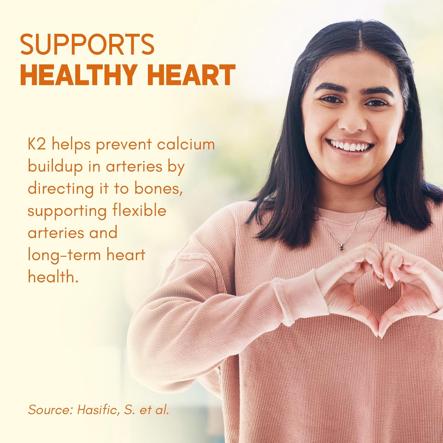 Woman making a heart shape with her hands with text about K2 supporting healthy heart health.