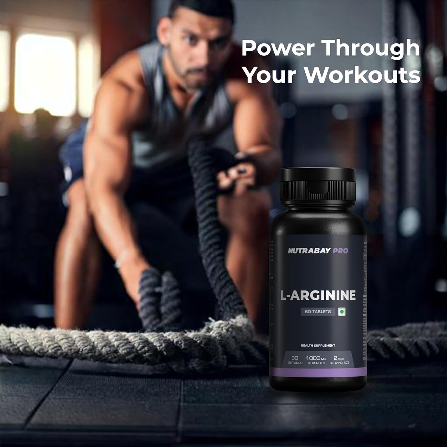 Person using battle ropes with a bottle of Nutrabay Pro L-Arginine in the foreground.