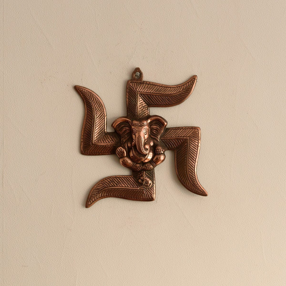 eCraftIndia Lord Ganesha on Swastik Metal Wall Hanging (22 cm x 3 cm x 24 cm, Brown)