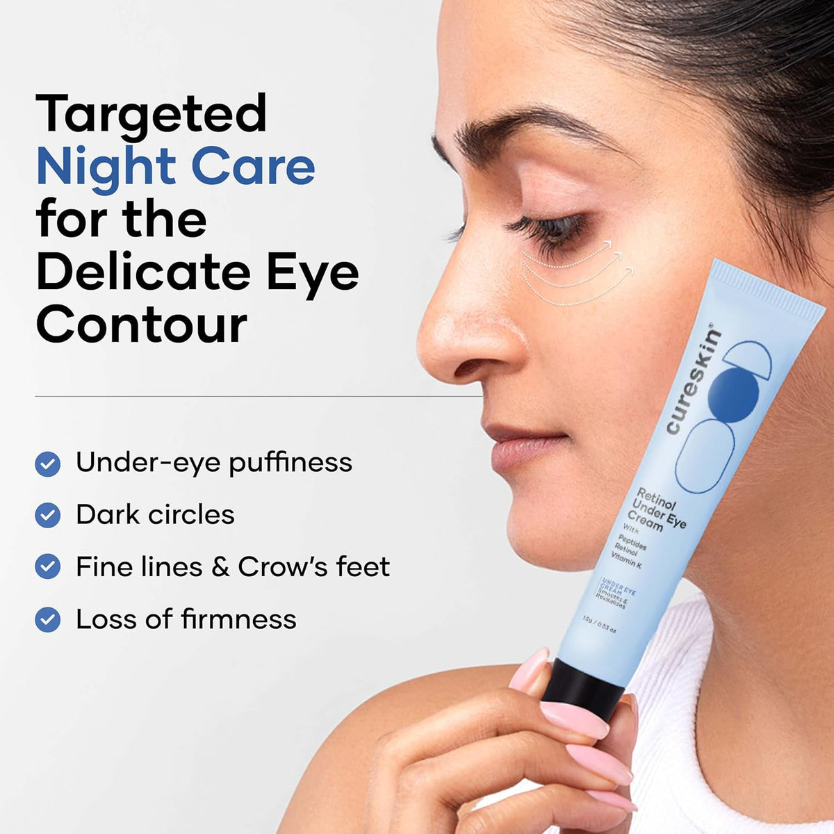 Woman holding a tube of Cureskin eye cream with product features listed.