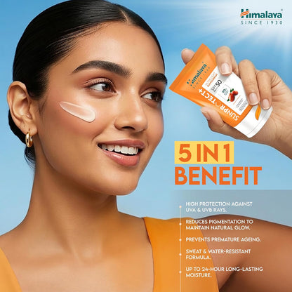 Woman applying sunscreen with Himalaya sunscreen packaging, against a blue sky.