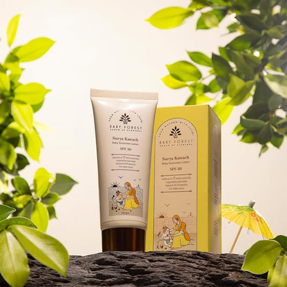 Baby Forest sunscreen tube and box with green leaves in the background