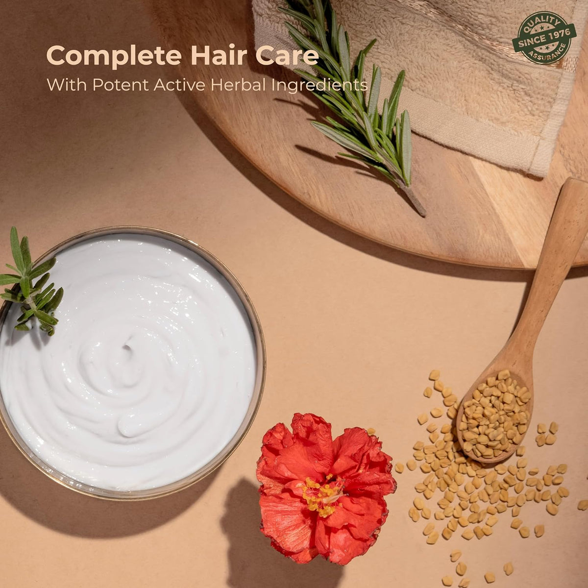 Hair care product with herbs, flower, and seeds on a wooden surface