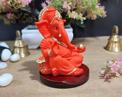Handcrafted Poly Resin Ganesha Statue with Base - Perfect for Car Dashboard, Office Desk, Shelves, and Home Decor - Ideal Housewarming Gift! (GaddiOrangewithbase)