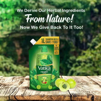 Vatika Henna Shampoo refill on a wooden surface with greenery in the background