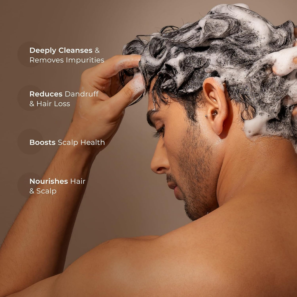 Man washing his hair with shampoo, showing scalp care benefits on a brown background