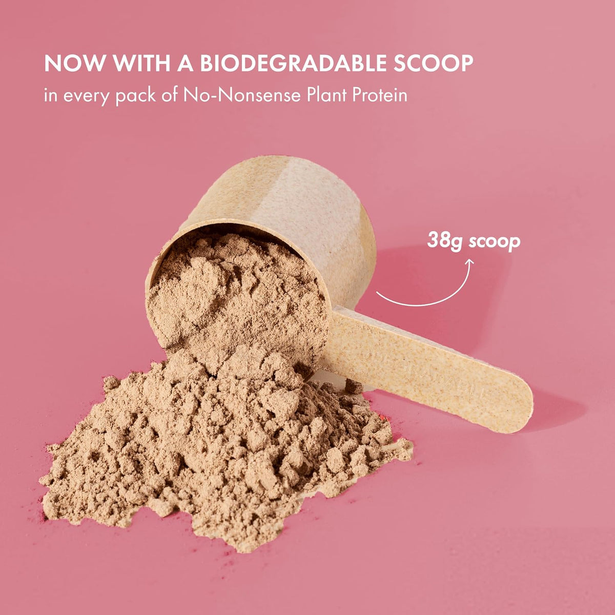 Biodegradable scoop with plant protein powder on a pink background