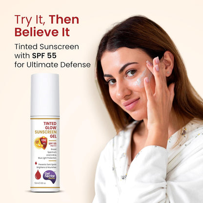 Woman applying sunscreen with a bottle of Nectar Tinted Glow Sunscreen Gel on a beige background