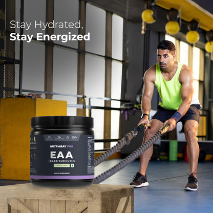 Person exercising with a container of Nutrabeat Pro EAA + Electrolytes supplement in a gym setting.