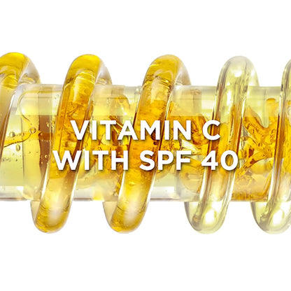 Vitamin C with SPF 40 text overlay on a close-up of yellow liquid in a glass tube.