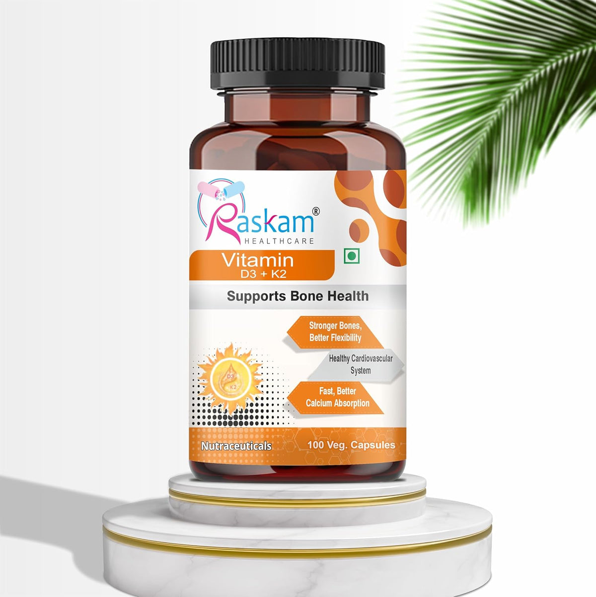 Bottle of Raskam Healthcare Vitamin D3 + K2 supplement on a white background with a palm leaf.