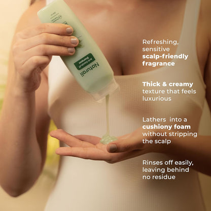 Person holding a bottle of Natura Siberica shampoo with product being poured into hands, featuring product benefits text.