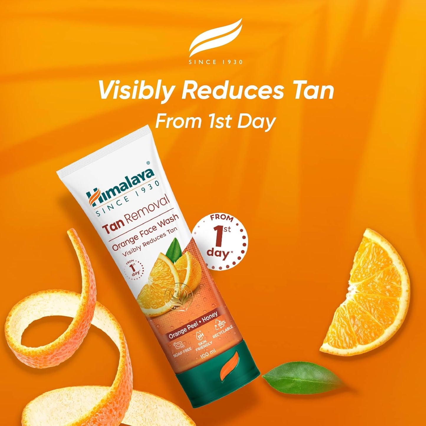Himalaya Tan Removal Face Wash with orange slices and peels on an orange background