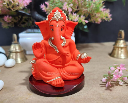 Handcrafted Poly Resin Ganesha Statue with Base - Perfect for Car Dashboard, Office Desk, Shelves, and Home Decor - Ideal Housewarming Gift! (GaddiOrangewithbase)