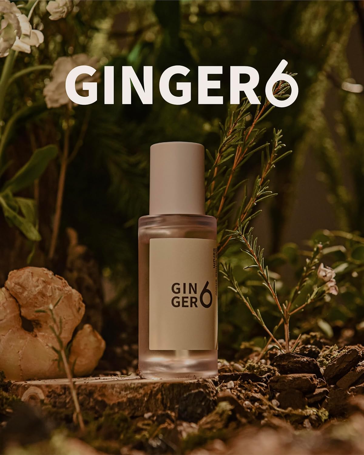 Ginger6 perfume bottle with ginger root and plants in the background