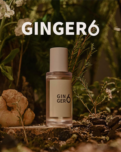 Ginger6 perfume bottle with ginger root and plants in the background