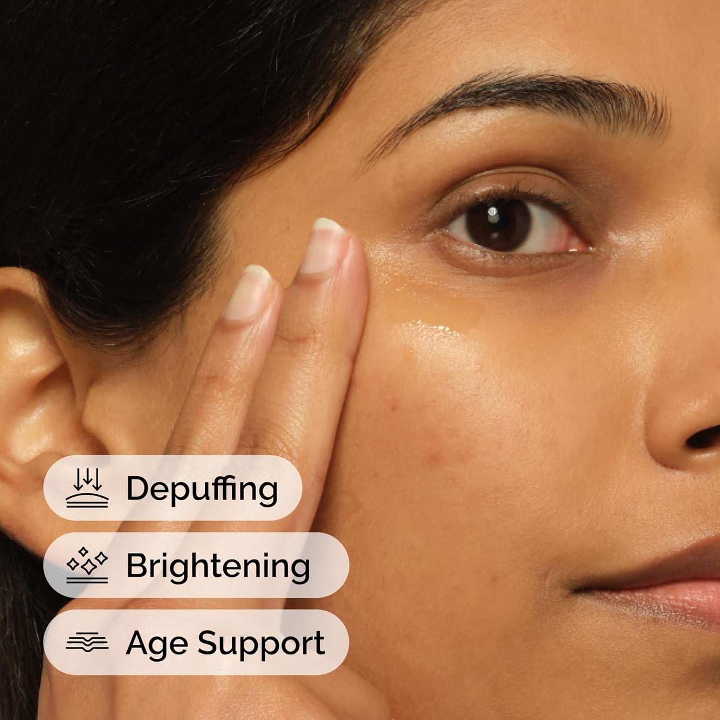 Close-up of a woman's face with text indicating depuffing, brightening, and age support benefits.