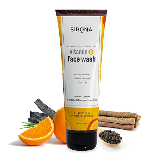 Sirona vitamin C face wash tube with oranges, charcoal, and licorice root on a white background