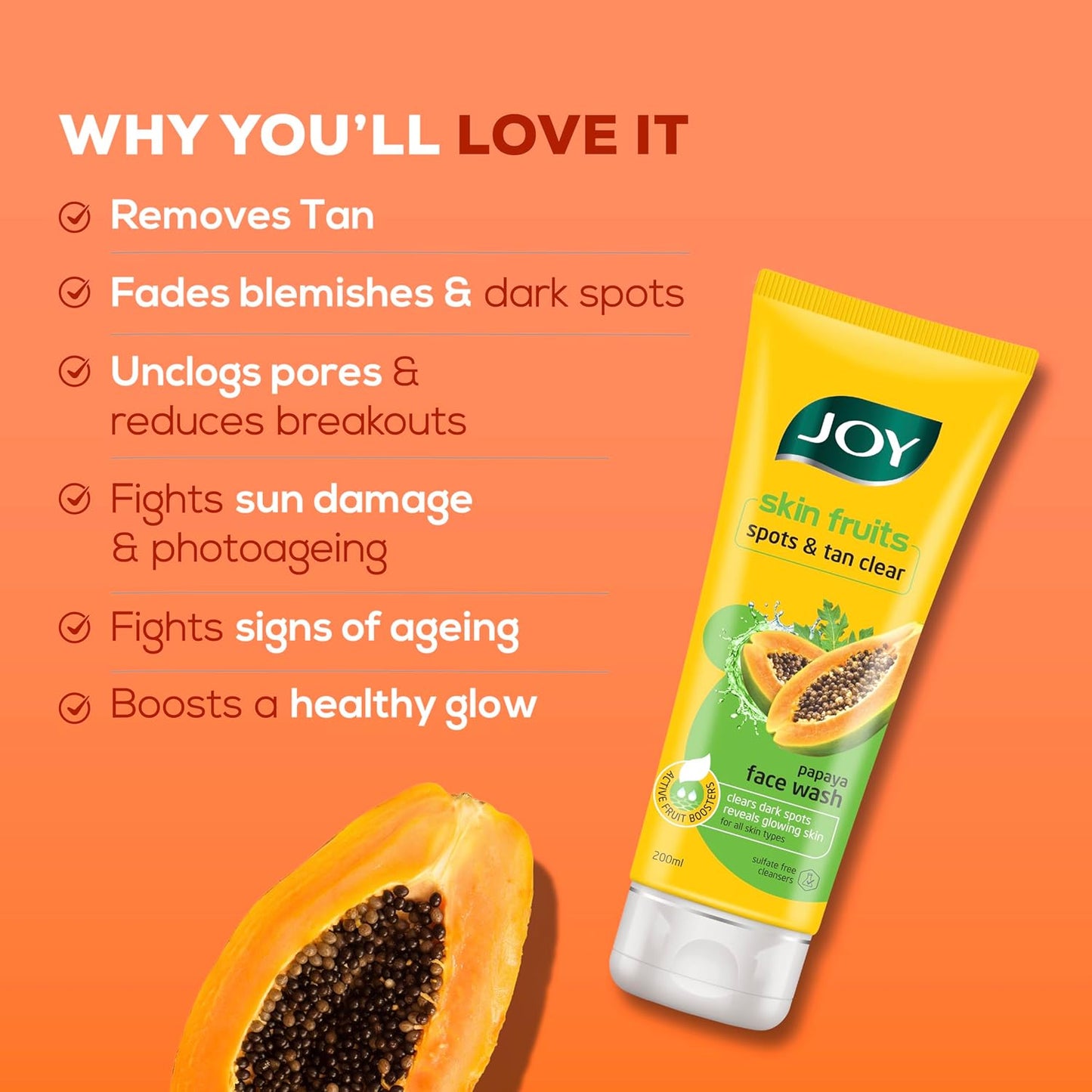 JOY skin fruits face wash tube with benefits listed on an orange background