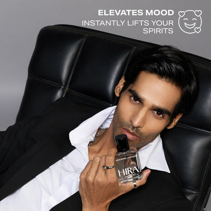 Man holding a bottle of Hira perfume with promotional text on a gray background