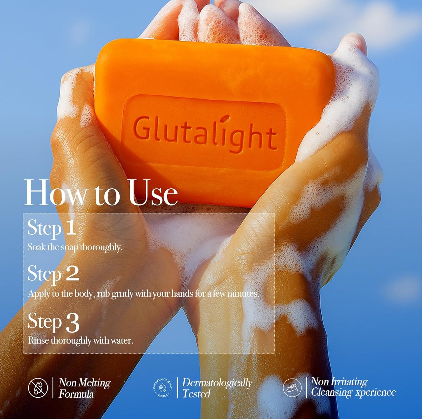 Orange soap bar with 'Glutalight' branding held by hands with soap suds against a blue sky.