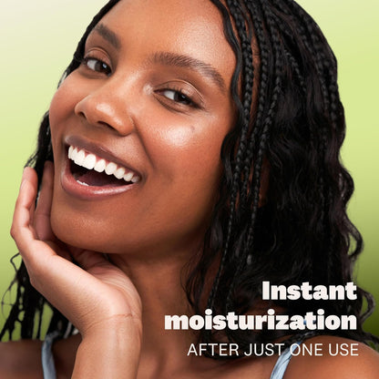 Woman with a happy expression on a green background with text about instant moisturization.