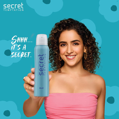 Woman holding a 'Secret Temptation' product with a blue floral background
