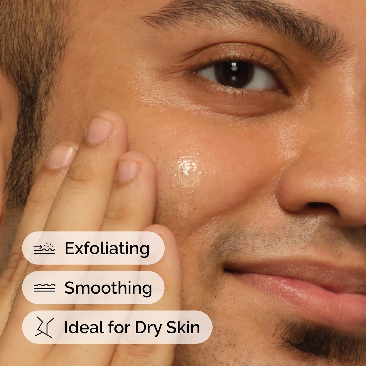Close-up of a man's face with exfoliating and smoothing text overlay